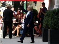 1: Democratic presidental nominee former Secretary of State Hillary Clinton waves as she leaves the home of her daughter Chelsea Clinton on September 11, 2016 in New York City.