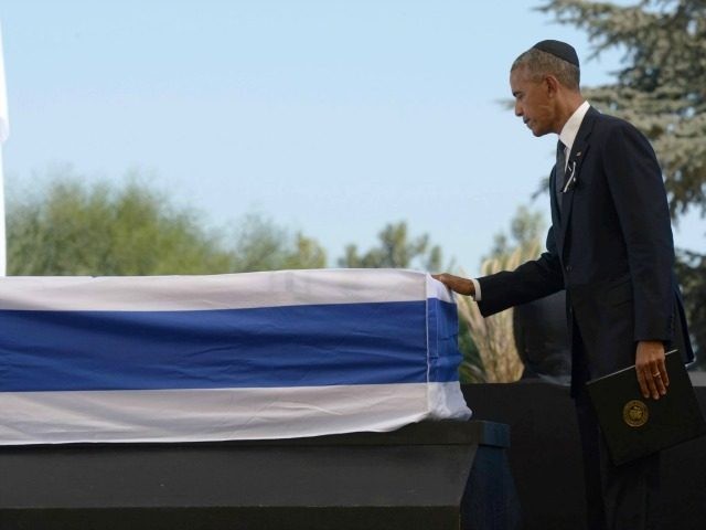In this handout photo provided by the Israel Government Press Office (GPO), U.S President Barack Obama touches the coffin of Shimon Peres September 30, 2016 in Jerusalem, Israel. World leaders and dignitaries from 70 countries attended the state funeral of Israel's ninth president, Shimon Peres, in Jerusalem on Friday.