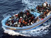 LAMPEDUSA, ITALY - JUNE 21:  A boat loaded with illegal immigrant is seen on  June 21, 2005 in Lampedusa, Italy. Tens of thousands of immigrants land on the Italian coast each year, most of them heading from north Africa on ramshackle boats.In the Mediterranean Sea between Malta and Tunisia, Lampedusa Island is one of the main gateways for illegal immigration from Africa into Europe. According to a report by Amnesty International, Illegal immigrants who land in Italy consistently allege they have been abused, holding centres are overcrowded and no legal assistance is offered. Italian authorities refused to give access to the centres to enable further investigations by Amnesty. The Amnesty International report says 15,647 people were held in the centres in 2004: a 9 per-cent increase on the previous year. (Photo by Marco Di Lauro/Getty Images)