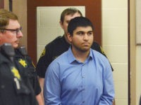 Arcan Cetin is escorted into Skagit County District Court by Skagit County's Sheriff's Deputies on Monday, Sept. 26, 2016. Cetin is being held under a magistrate's warrant which will give Skagit County prosecutors 30 days to file charges in relation to the Cascade Mall shooting that took place on Friday evening. Five people were killed in the shooting, and Cetin is being held on a $2 million bail. (Brandy Shreve/Skagit Valley Herald via AP)
