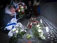 People light candles and place Israeli flags on February 16, 2015 in front the Danish Embassy in Brussels for the the victims of weekend attacks on a cultural center and a synagogue in Copenhagen that left two people dead including a 37-year-old Jewish man as well as a 55-year-old film-maker attending a debate on Islam and freedom of the press. AFP PHOTO / BELGA / LAURIE DIEFFEMBACQ - BELGIUM OUT - (Photo credit should read LAURIE DIEFFEMBACQ/AFP/Getty Images)