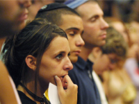 JERUSALEM - AUGUST 12: Foreign students cry during a ceremony to honor victims of an explosion at a Hebrew University cafeteria, organized by The International School for Overseas Students August 12, 2002 in Jerusalem, Israel. The July 31, 2002 bomb blast killed eight people, including five American citizens. (Photo by Quique Kierszenbaum/Getty Images)