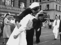 FILE - In this Aug. 14, 1945 file photo provided by the U.S. Navy, a sailor and a nurse kiss passionately in Manhattan's Times Square, as New York City celebrates the end of World War II. The woman who was kissed by an ecstatic sailor in Times Square celebrating the end of World War II has died at the age of 92. Greta Zimmer Friedman's son says his mother died Thursday, Sept. 8, 2016, at a hospital in Richmond, Virginia. She died from complications of old age, he said. (AP Photo/U.S. Navy/Victor Jorgensen, File)