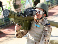 members of the Iraqi army carries a man-portable air-defence system (MANPAD) as he stands on a vehicle during a yearly military parade on February 1, 2015 in the capital Baghdad. Violence in Iraq killed 1,375 people in January, month eight of the battle against jihadists who swept through large areas of the country last summer, the United Nations said. AFP PHOTO / SABAH ARAR (Photo credit should read SABAH ARAR/AFP/Getty Images)