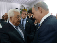 In this handout photo provided by the Israel Government Press Office (GPO), Israeli Prime Minister Benjamin Netanyahu shakes hands with Palestinian Authority President Mahmoud Abbas during the funeral of former Israeli leader Shimon Peres on September 30, 2016 in Jerusalem, Israel. World leaders and dignitaries from 70 countries attended the state funeral of Israel's ninth president, Shimon Peres, in Jerusalem on Friday, after thousands of Israelis paid their last respects to the elder statesman who died on Wednesday. (Photo by Amos Ben Gershom/GPO via Getty Images)
