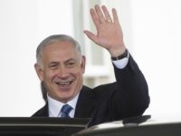 Israeli Prime Minister Benjamin Netanyahu waves after a bilateral meeting at the White House in Washington, DC, October 1, 2014. A skeptical Israeli Prime Minister Benjamin Netanyahu on Wednesday directly warned President Barack Obama not to accept any Iran deal that would allow Tehran to become a 'threshold nuclear power.' Netanyahu and Obama renewed their often prickly relationship in the Oval Office, meeting for the first time since their governments swapped some of the most harsh rhetoric in years over the Gaza crisis. AFP PHOTO / Jim WATSON (Photo credit should read JIM WATSON/AFP/Getty Images)