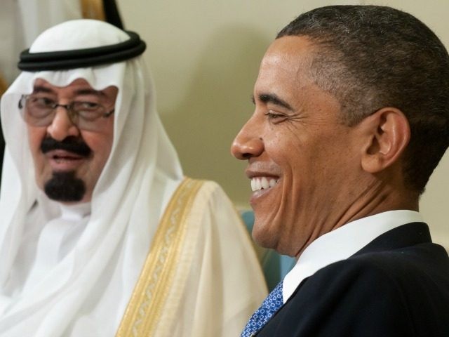 US President Barack Obama smiles alongside King Abdullah bin Abdulaziz Al Saud of Saudi Arabia during meetings in the Oval Office at the White House in Washington, DC, June 29, 2010. AFP PHOTO / Saul LOEB (Photo credit should read SAUL LOEB/AFP/Getty Images)