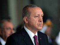 Turkish President Recep Tayyip Erdogan stands at the mausoleum of modern Turkey's founder Mustafa Kemal Ataturk on Victory Day in Ankara, Turkey, Tuesday, Aug. 30, 2016. Turkish army's 94-year-old victory over Greece was considered crucial in Turkish Independence War and the foundation of modern Turkish republic. (AP Photo/Burhan Ozbilici)