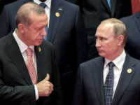 2927724 09/04/2016 September 4, 2016. Russian President Vladimir Putin, right, and Turkish President Recep Erdogan during the group photo session of the heads of G20 nations, invitees and international organizations in Hangzhou. Sergey Guneev/Sputnik via AP