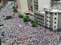 TOPSHOT - Opposition activists march in Caracas, on September 1, 2016. Venezuela's opposition and government head into a crucial test of strength Thursday with massive marches for and against a referendum to recall President Nicolas Maduro that have raised fears of a violent confrontation. / AFP / STR (Photo credit should read STR/AFP/Getty Images)