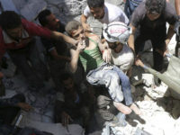 SYRIA, ALEPPO : (FILES) This file photo taken on July 25, 2016 shows Syrian civil defence volunteers, known as the White Helmets, carrying a young boy after they dug him out from under the rubble of buildings destroyed following reported air strikes on the rebel-held neighbourhood of Al-Mashhad in the northern city of Aleppo, on July 25, 2016. The Syrian Civil Defense organisation "White Helmets" is announced on September 22, 2016 as one of four laureates of the Right Livelihood Award, dubbed as "Alternative Nobel Prize", besides Russian human rights advocate Svetlana Gannouchkina of Memorial, Mozn Hassan of the organisation for Feminist studies "Nazra" and Turkish independant newspaper Cumhuriyet. / AFP PHOTO / THAER MOHAMMED