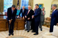 US President Barack Obama tweeted this photo of a lesson Arnold Palmer gave him in the Oval Office of the White House