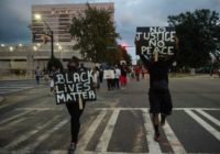 Protesters march during a demonstration against police brutality in Charlotte, North Carolina, on September 21, 2016