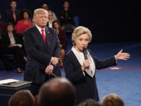 Democratic presidential nominee Hillary Clinton speaks as Republican presidential nominee Donald Trump listens during the second presidential debate at Washington University in St. Louis, Sunday, Oct. 9, 2016. (Rick T. Wilking/Pool via AP)
