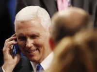 Republican vice-presidential nominee Gov. Mike Pence speaks on a phone after the vice-presidential debate with Democratic vice-presidential nominee Sen. Tim Kaine at Longwood University in Farmville, Va., Tuesday, Oct. 4, 2016. (AP Photo/Steve Helber)