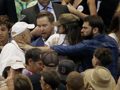Anti-Trump protester chokes Trump fan (Ross D. Franklin / Associated Press)