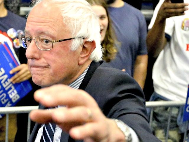 Democratic presidential candidate Sen. Bernie Sanders, I-Vt., waves as he leaves a campaign rally at Fitzgerald Fieldhouse on the University of Pittsburgh campus, Monday, April 25, 2016, in Pittsburgh. (AP Photo/Keith Srakocic)