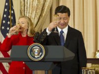 Chinese Vice President Xi Jinping (C) proposes a toast with Vice President Joe Biden (R) and Secretary of State Hillary Clinton (L) during a a lunch in honor of Chinese VP at the State Department in Washington, DC,  February 14, 2012.         AFP PHOTO/Jim WATSON        (Photo credit should read JIM WATSON/AFP/Getty Images)