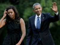 AFP OUT U.S. President Barack Obama and first lady Michelle Obama walk across the South Lawn after returning to the White House on Marine One July 12, 2016 in Washington, DC. The Obamas were returning from Dallas where they attended a public memorial service for the five Dallas police officers who were killed by a sniper last week during a Black Lives Matter demonstration.