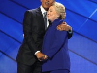 PHILADELPHIA, PA - JULY 27:  US President Barack Obama and Democratic presidential candidate Hillary Clinton embrace on the third day of the Democratic National Convention at the Wells Fargo Center, July 27, 2016 in Philadelphia, Pennsylvania. Democratic presidential candidate Hillary Clinton received the number of votes needed to secure the party's nomination. An estimated 50,000 people are expected in Philadelphia, including hundreds of protesters and members of the media. The four-day Democratic National Convention kicked off July 25.  (Photo by