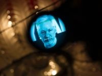 Julian Assange, founder of the online leaking platform WikiLeaks, is seen through the eyepeace of a camera as he is displayed on a screen via a live video connection during a press conference on the platform's 10th anniversary on October 4, 2016 in Berlin.
WikiLeaks celebrates its 10th birthday defiantly proud as the pioneer of online leaking platforms, while its controversial founder vows to pursue its work despite widespread criticsm. / AFP / STEFFI LOOS        (Photo credit should read STEFFI LOOS/AFP/Getty Images)