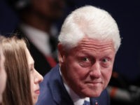 ST LOUIS, MO - OCTOBER 09:  (R-L) Former U.S. President Bill Clinton, daughter Chelsea Clinton and Marc Mezvinsky sit before the town hall debate at Washington University on October 9, 2016 in St Louis, Missouri. This is the second of three presidential debates scheduled prior to the November 8th election.  (Photo by Scott Olson/Getty Images)