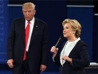 Democratic presidential candidate Hillary Clinton and US Republican presidential candidate Donald Trump debate during the second presidential debate at Washington University in St. Louis, Missouri, on October 9, 2016. / AFP / Robyn Beck (Photo credit should read