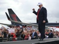 Republican presidential candidate Donald Trump takes to the stage to speak during a campaign rally at the Lakeland Linder Regional Airport on October 12, 2016 in Lakeland, Florida.