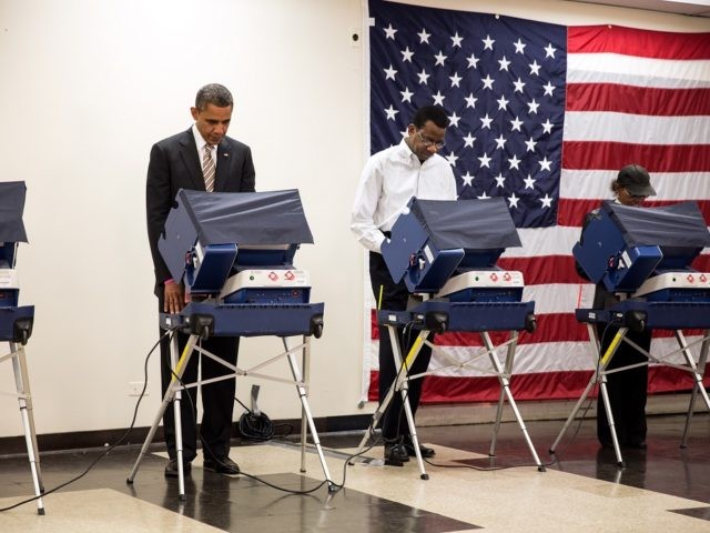 President Barack Obama casts his ballot during early voting at the Martin Luther King Jr. Community Center in Chicago, Ill., Oct. 25, 2012.   (Official White House Photo by Pete Souza)  This official White House photograph is being made available only for publication by news organizations and/or for personal use printing by the subject(s) of the photograph. The photograph may not be manipulated in any way and may not be used in commercial or political materials, advertisements, emails, products, promotions that in any way suggests approval or endorsement of the President, the First Family, or the White House.