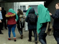 EXCLUSIVE PICS: ‘Child’ Migrants Arrive in UK Covered by Blankets 