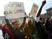 Protesters rally at Teachers College at Columbia University October 10, 2007, in New York City. Black professor Madonna Constantine discovered a hangman's noose on her office door at the prestigious college yesterday sparking anger at the campus. (Photo by Mario Tama/Getty Images)