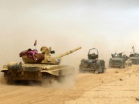 TOPSHOT - Iraqi forces deploy on October 17, 2016 in the area of al-Shurah, some 45 kms south of Mosul, as they advance towards the city to retake it from the Islamic State (IS) group jihadists. Some 30,000 federal forces are leading the offensive, backed by air and ground support from a 60-nation US-led coalition, in what is expected to be a long and difficult assault on IS's last major Iraqi stronghold. / AFP / AHMAD AL-RUBAYE (Photo credit should read AHMAD AL-RUBAYE/AFP/Getty Images)