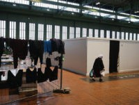 BERLIN, GERMANY - FEBRUARY 11:  Laundry hangs to dry in Hangar 7 where refugees and migrants seeking asylum in Germany live for now at former Tempelhof Airport on February 11, 2016 in Berlin, Germany. Tempelhof, once an airport in the city center and first built in the 1930s, now houses approximately 2,600 refugees in three former hangars. Berlin city authorities recently approved plans to expand its capacity to house the newcomers with an additional 90 shelters with space for 30,000 people. An estimated 50,000-80,000 migrants and refugees already live in Berlin. Germany received 1.1 million refugees and migrants in 2015 and is expecting to continue to receive large numbers in 2016.  (Photo by Sean Gallup/Getty Images)