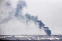 Picture taken from the Israel-Gaza border shows smoke rising from the Palestinian Hamas-run Gaza Strip following an Israeli military strike on October 5, 2016