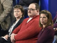 Ken Bone (C) listens to US Democratic nominee Hillary Clinton and Republican nominee Donald Trump during the second presidential debate at Washington University in St. Louis, Missouri