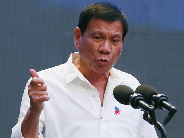 FILE - In this Oct. 13, 2016 file photo, Philippine President Rodrigo Duterte gestures during his address to a Filipino business sector in suburban Pasay city south of Manila, Philippines. This week's visit to China by Duterte points toward a restoration of trust between the sides following recent tensions over their South China Sea territorial dispute, China's official news agency said Tuesday, Oct. 18. (AP Photo/Bullit Marquez, File)