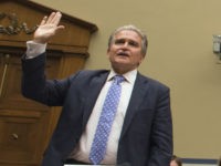 Witnesses are sworn in to testify before the House Oversight and Government Reform Committee hearing on classifications and redactions in FBI's investigative file of former Secretary of State Hillary Clinton, in Washington, Monday, Sept. 12, 2016. From left Peter Kadzik, Assistant Attorney General for Legislative Affairs, U.S. Department of Justice; Julia Frifield, Assistant Secretary, Bureau of Legislative Affairs, U.S Department of State; Jason Herring, Acting Assistant Director for Congressional Affairs at the FBI; Deirdre Walsh, Assistant Director for Legislative Affairs, Office of the Director of National Intelligence; Neal Higgins, Director of Congressional Affairs at the CIA and James Samuel, Jr., Chief of Congressional Affairs, NGA. (AP Photo/Molly Riley)