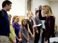 Ivanka Trump jokes with a student about his height during a campaign stop for her father, Republican presidential candidate Donald Trump, Thursday, Nov. 3, 2016, at the Founders Academy, a public chartered school in Manchester, N.H.