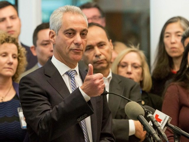 Chicago Mayor Rahm Emanuel, center, speaks at a news conference Monday, Nov. 14, 2016, in Chicago. Emanuel said the outcome of the U.S. presidential election will not impact Chicago's commitment as a sanctuary city for immigrants.