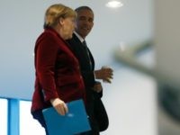 President Barack Obama walks with German Chancellor Angela Merkel at the German Chancellery in Berlin, Thursday, Nov. 17, 2016. (