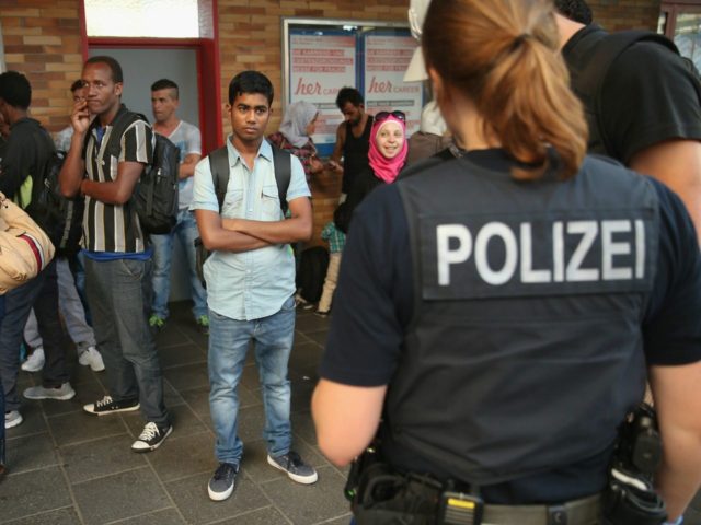 German police and migrants