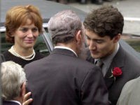 MONTREAL, CANADA:  Cuban President Fidel Castro (C) embraces Justin Trudeau (R), the son of former Canadian Prime Minister Pierre Trudeau, after arriving at the Notre Dame Basilica for Trudeau's state funeral 03 October 2000. Trudeau, who was considered to be one of Canada's most charismatic prime ministers, died of prostate cancer at age 80 at his home 28 September. Trudeau's ex-wife Margaret can be seen at left.  AFP PHOTO/JEFF KOWALSKY (Photo credit should read JEFF KOWALSKY/AFP/Getty Images)
