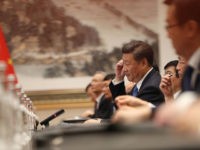 Chinese President Xi Jinping (C) adjusts his ear phones during his meeting with US President Barack Obama at the West Lake State Guest House in Hangzhou on September 3, 2016.
The United States and China on September 3 formally joined the Paris climate deal, with US President Barack Obama hailing the accord as the "moment we finally decided to save our planet". World leaders are gathering in Hangzhou for the 11th G20 Leaders Summit from September 4 to 5. / AFP / POOL / HOW HWEE YOUNG        (Photo credit should read HOW HWEE YOUNG/AFP/Getty Images)