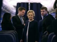 Democratic presidential nominee former Secretary of State Hillary Clinton talks with members of her staff aboard her campaign plane at Westchester County Airport on November 4, 2016 in White Plains, New York.