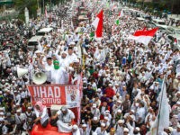 JAKARTA, INDONESIA - NOVEMBER 04:  Protesters march to the Merdeka Palace  on November 4, 2016 in Jakarta, Indonesia. Indonesian police fired tear gas and water cannon to disperse hardline Muslim protesters outside the Presidential Palace in Jakarta, demanding for the city's Christian Governor Basuki T. Purnama to be prosecuted for alleged blasphemy. The accusation leveled against Jakarta Govneror Basuki "Ahok" Tjahaja Purnama, an ethnic Chinese, who is running in Indonesia's upcoming election, a country with the world's largest Muslim population.  (Photo by Oscar Siagian/Getty Images)