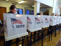 People vote on the US presidential election at Santa Monica City Hall on November 8, 2016 in Santa Monica, California. America's future hung in the balance Tuesday as millions of eager voters cast ballots to elect Democrat Hillary Clinton as their first woman president, or hand power to the billionaire populist Donald Trump. / AFP / Frederic J. BROWN (Photo credit should read FREDERIC J. BROWN/AFP/Getty Images)