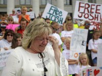 FILE - In this July 30, 2016, file photo, Laurie Holt, the mother of Joshua Holt, an American jailed in Venezuela, cries during a rally at the Utah State Capitol, in Salt Lake City. At a press conference Tuesday, Oct. 11 attorney Jeanette Prieto said Holt was stripped naked and made to perform exercises in a hallway. She said the mistreatment violated international treaties. (AP Photo/Rick Bowmer, File)