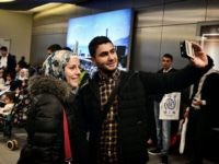 Houda and her husband take a selfie at the airport in Athens before boarding a special charter plane bound for France in the frames of the EU relocation program for refugees on November 3, 2016. 
The group consisted of 168 mainly Syrian families, Iraqis and Eritreans, including 58 small children. The EU is still away from its promise of 66,400 relocations from Greece. There are currently some 19,000 people in the country eligible for the program. / AFP / LOUISA GOULIAMAKI        (Photo credit should read LOUISA GOULIAMAKI/AFP/Getty Images)