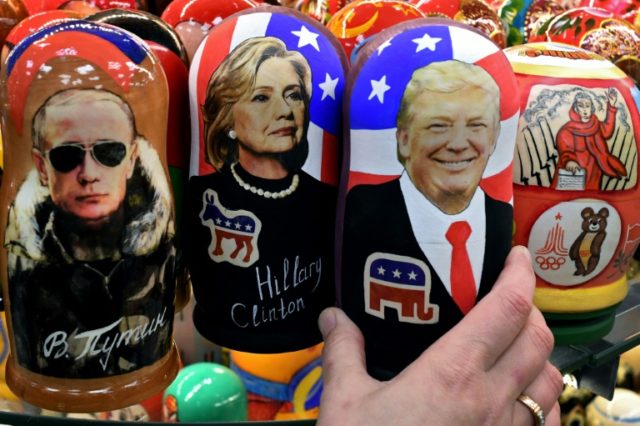 Traditional Russian Matryoshka dolls in Moscow, depict (L-R) Russian President Vladimir Putin, Hillary Clinton and US Republican president elect Donald Trump