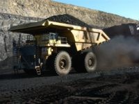 In this Nov. 15, 2016 photo, a haul truck with a 250-ton capacity carries coal from the Spring Creek strip mine near Decker, Mont.